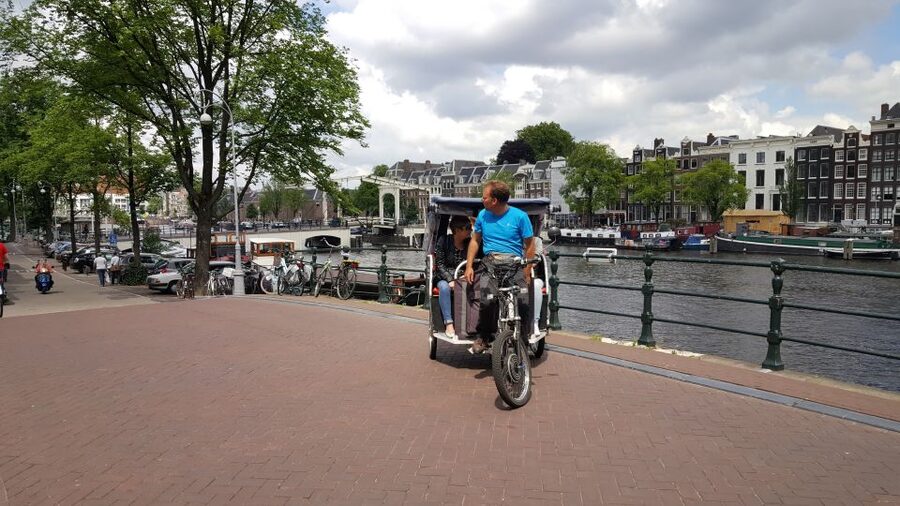 Amsterdam 1-Hour Rickshaw Tour - Your guide, Jan’s Fietstaxi, and the stories that make it stick