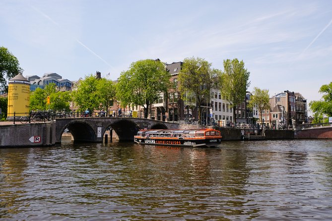 Amsterdam 1h Canal Cruise by Semi-Open Boat with Audio Guide - Crowds, weather, and comfort: what to plan for