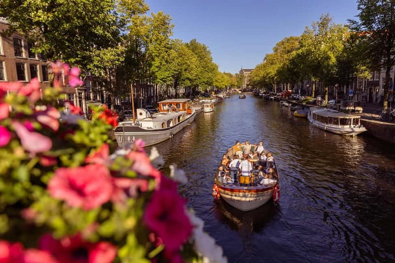 Amsterdam: 2-Hour Luxury Canal Cruise with Snacks & Drinks - On-board comfort: open-air vibes, blankets, and a cozy feel
