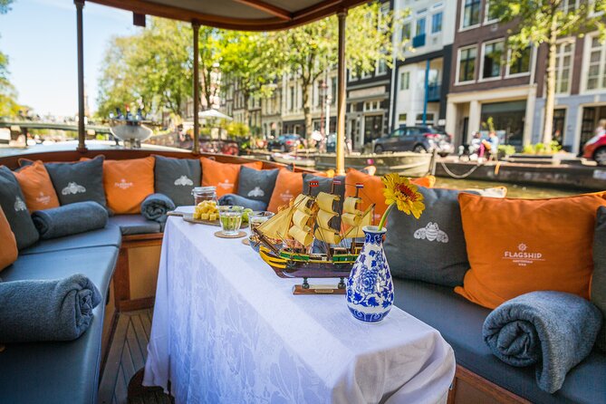 Amsterdam Canal Cruise in Classic Salon Boat With Drinks and Cheese - Entering the canals: what the guide actually does