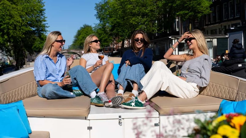 Amsterdam: Canal Cruise in Open Boat with Drink Option - The guided route: Westerkerk, Negen Straatjes, Prinsengracht, and Carré