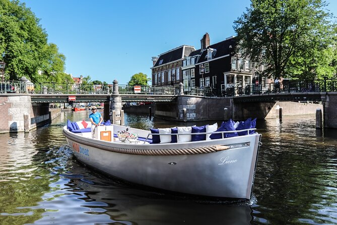 Amsterdam Canal Cruise in Open Boat with Unlimited Drinks Option - When to go: cold rain plans, sunset timing, and crowd levels
