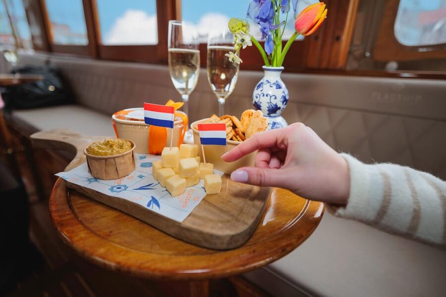 Amsterdam: Canal Cruise with Bubbles & Bites - Comfort on the water: covered boat, weather, and photo angles