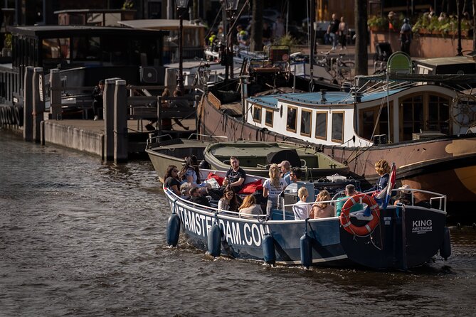 Amsterdam Canal Cruise with Live guide & Two drinks - Central St. - One hour, two drinks, and canal views from the city center