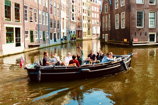 Amsterdam Canal Tour by Open Boat – 90 min Small Group Experience - De Wallen From the Water: Oudezijds Voorburgwal Without the Noise