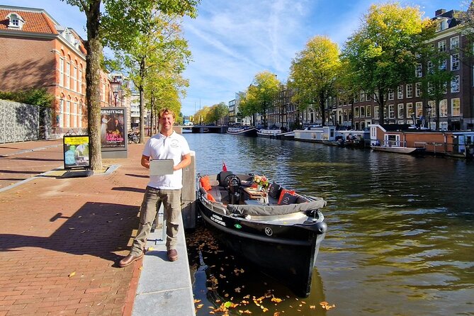 Amsterdam Canal Tour by Open Boat – 90 min Small Group Experience - Zuiderkerk, the Oldest Churches, and the Kolksluis Lock Stop