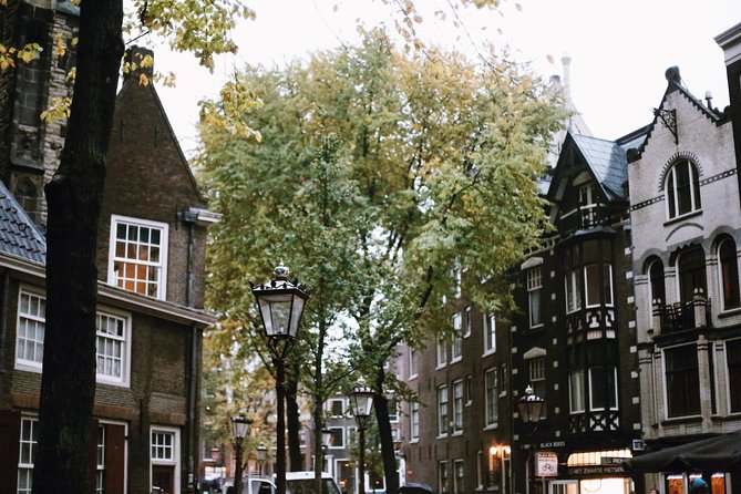 Amsterdam City Center Guided Walking Tour Semi-Private 12ppl Max - Oost-Indisch Huis courtyard: where global trade began at local scale