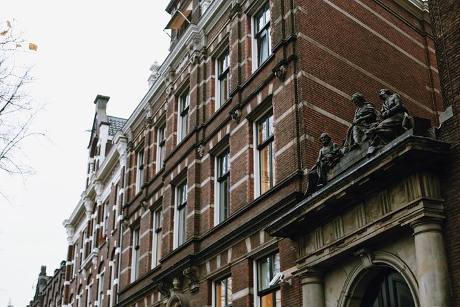 Amsterdam City Center Guided Walking Tour Semi-Private 12ppl Max - Begijnhof and three-canals magic: calmer courtyards and rare canal façades