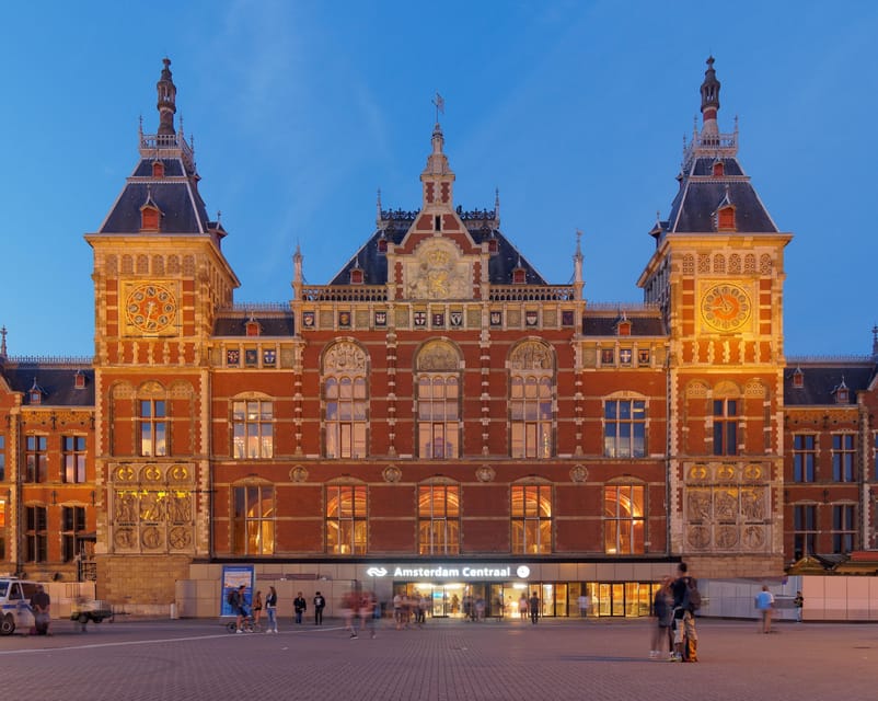 Amsterdam: City Highlights Walking Tour - Damrak street walking: the center’s everyday culture in one stretch
