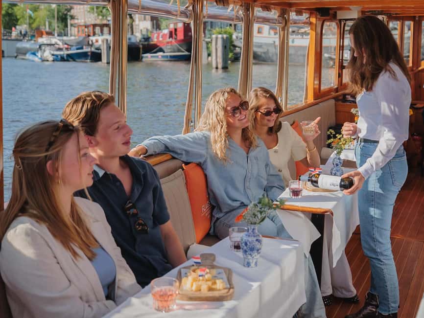 Amsterdam: Classic Saloon Boat Cruise with Cheese & Wine - Price and value for a 1-hour guided canal cruise