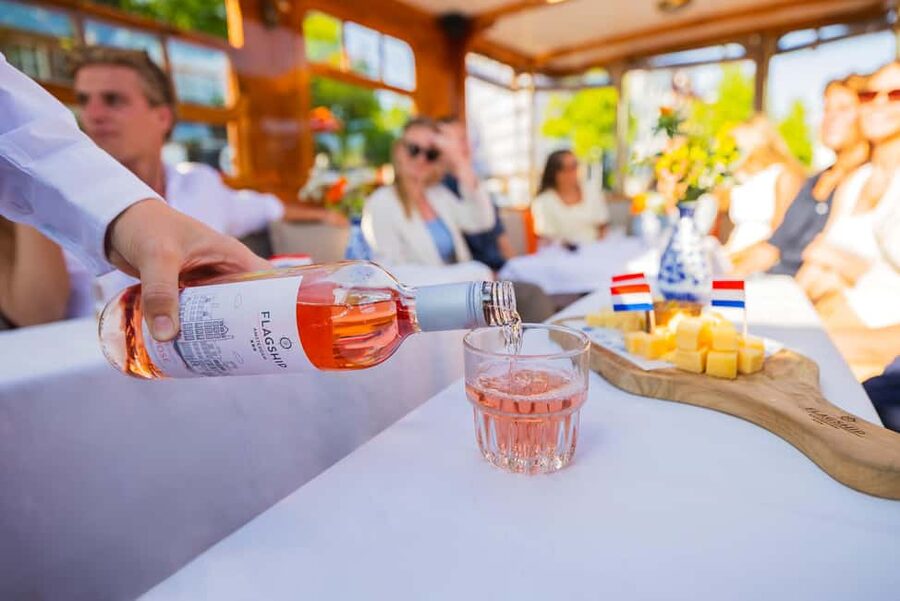 Amsterdam: Classic Saloon Boat Cruise with Cheese & Wine - Cheese and wine options, and why the unlimited-drinks style matters