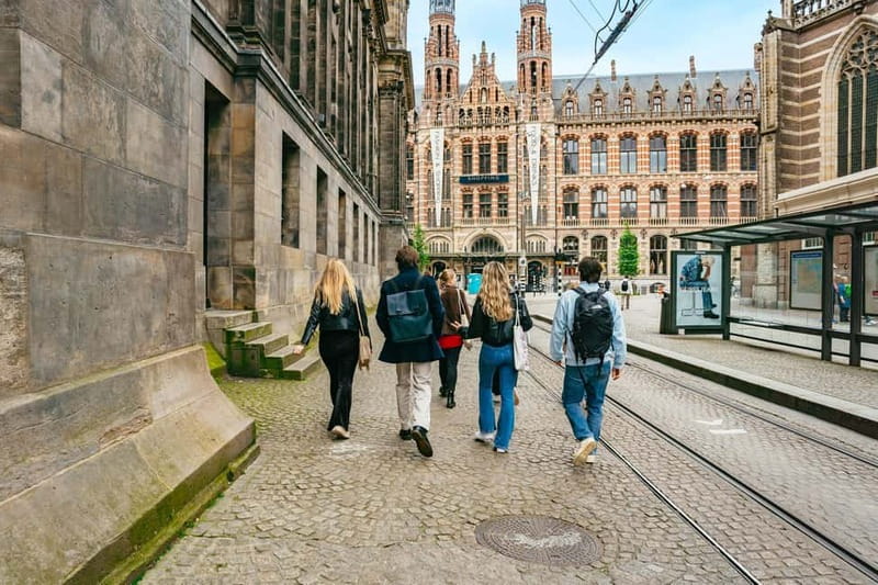 Amsterdam: Cultural Highlights Walking Tour - Back to the Amstel and the final stop at the monument