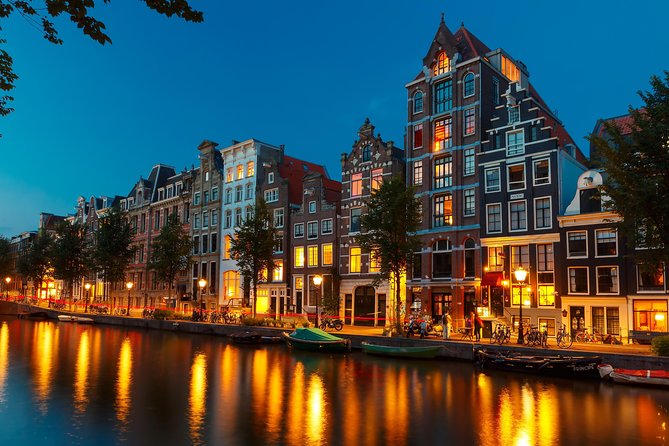 Amsterdam Evening Canal Cruise with Live Guide and Onboard Bar - Landmark run-down: Westerkerk to the Amstel dam loop