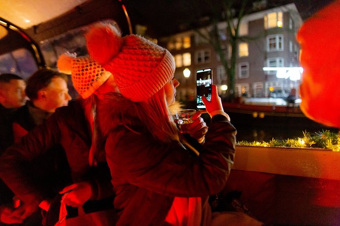 Amsterdam Evening Canal Cruise with Live Guide and Onboard Bar - Dress for cold water, and handle crowds like a local