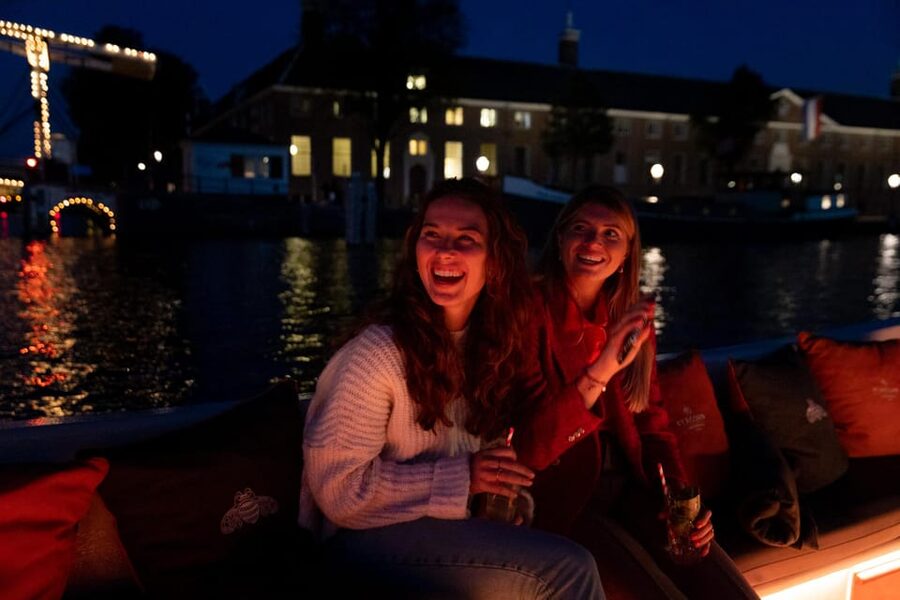 Amsterdam: Evening Canal Cruise with (Open) Bar on Board - Skinny Bridge and romantic stops: how this moment plays in real life