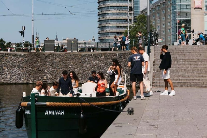 Amsterdam Evening (Sunset) Canal Cruise w/ optional drinks - Your Onboard Experience: Local Storytelling and a Multi-Language Guide