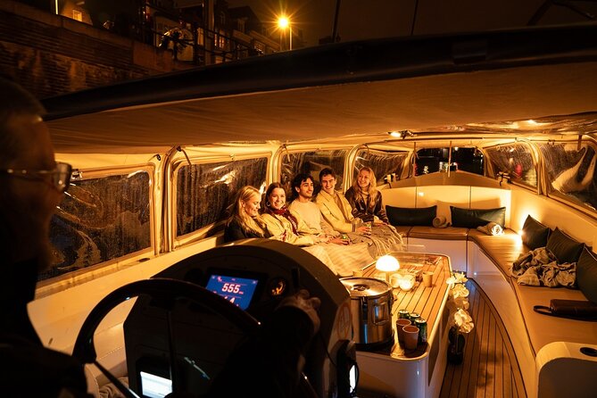 Amsterdam Evening (Sunset) Canal Cruise with optional drinks - Open-boat comfort: sunscreen in summer, hood and ponchos if it rains