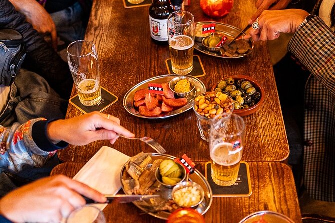 Amsterdam Food Tour: +10 Tastes, Culture and Canals with Sherpa - Underground Waterlooplein stops and Surinamese bites with history