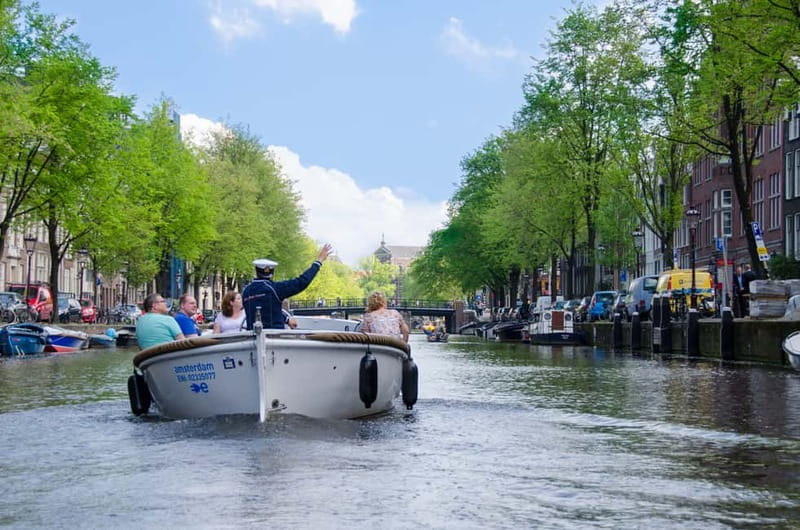 Amsterdam: Guided City Highlights Open Boat Canal Cruise - Why an open-boat cruise on Amsterdam canals hits different