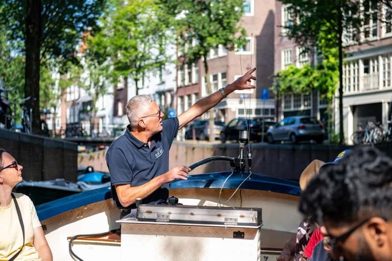 Amsterdam: Guided City Highlights Open Boat Canal Cruise - The 75-minute highlight loop, and what to watch at each stage
