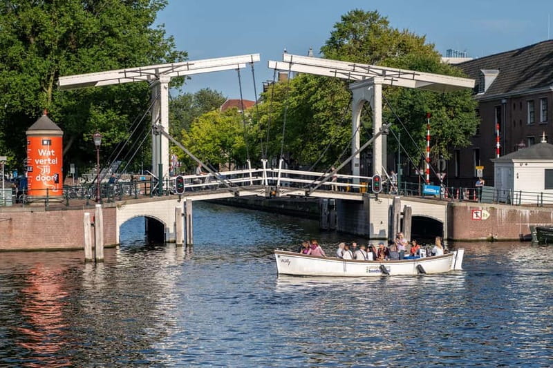 Amsterdam: Guided City Highlights Open Boat Canal Cruise - Live captain narration: what makes the stories stick