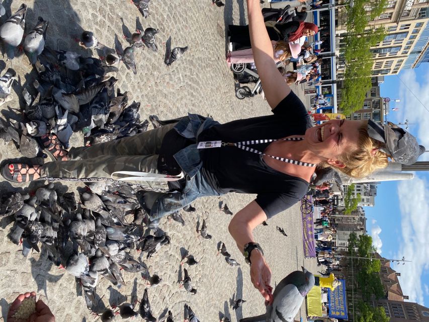 Amsterdam: Guided Off-The-Beaten-Track Walking Tour - Torensluis and the canal belt story near Magna Plaza