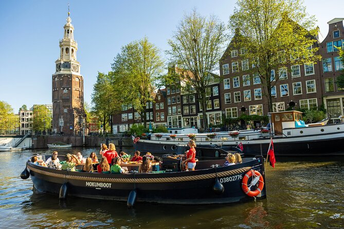 Amsterdam: Guided Open Boat Canal Cruise Unlimited Drinks Option - Stationsplein to the water: getting started without stress