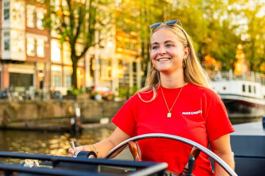 Amsterdam: Guided Open Boat Cruise Unlimited Drinks Option - The Boat Ride Experience: Breeze, Space to Move, and Warm Gear