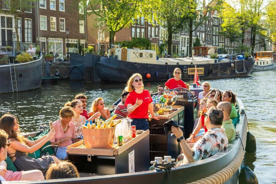 Amsterdam: Guided Open Boat Cruise Unlimited Drinks Option - Stops and Photo Moments, From Central Amsterdam to the Canal Side Streets