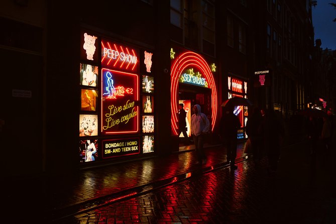 Amsterdam: Guided Red Light District and City Walking Tour - Entering the streets: start point, pace, and what two hours feels like