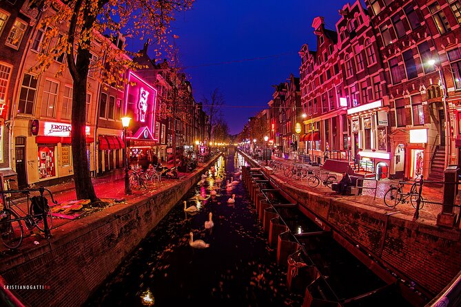 Amsterdam: Guided Red Light District and City Walking Tour - Dam to Old Town: Amsterdam’s wooden-pole reality check