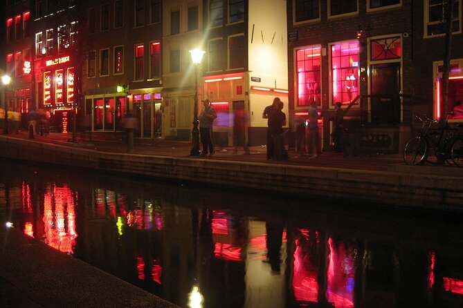 Amsterdam: Guided Red Light District and City Walking Tour - Pub The Ape: the wooden-building survival story after 1452