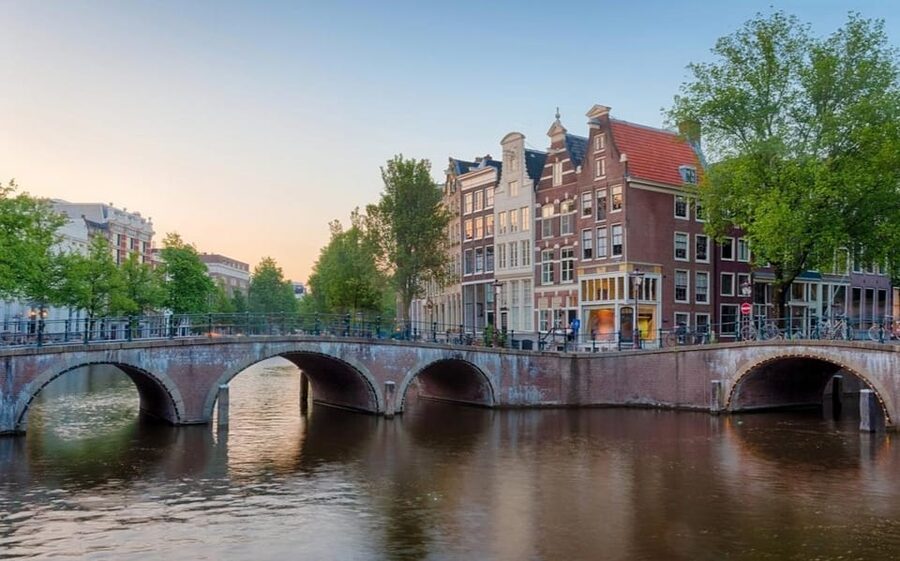 Amsterdam: Haunted History and Ghost Walking Tour - Starting at Dam Square, the city turns from postcard to past