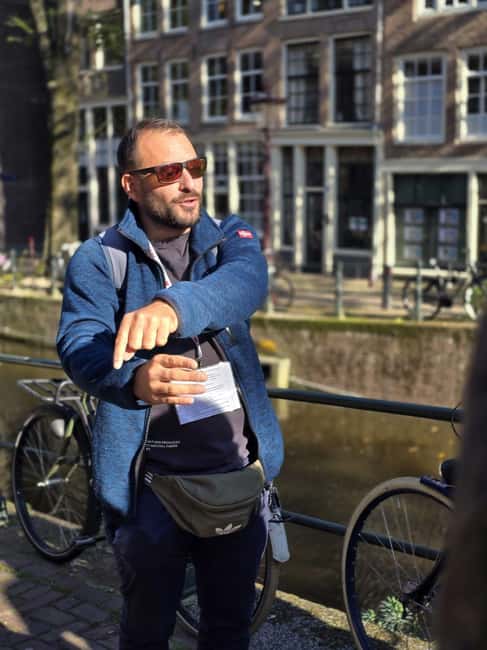 Amsterdam: History, Hidden Gems & Future Eco-Walking Tour - Water and wind: how this Amsterdam tour starts below sea level