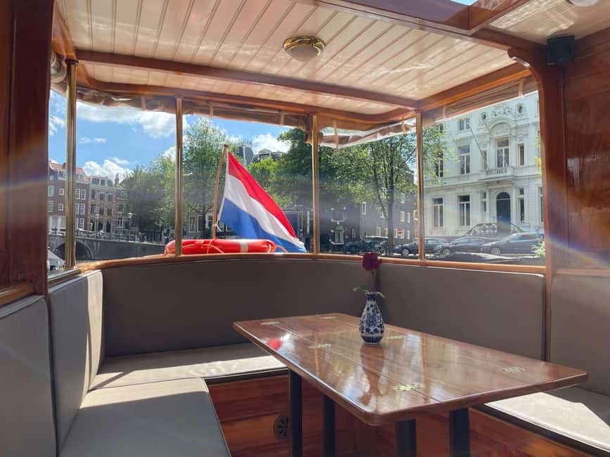 Amsterdam: King's Day Party Cruise with Open Bar & Music - The 1.5-hour ride: what it feels like from boarding to return
