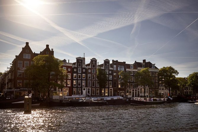 Amsterdam Light Festival: Saloon Boat Cruise + Hot Drinks & Bite - On-Board Setup: Covered Boat, Step Up, and Live Guide Flow