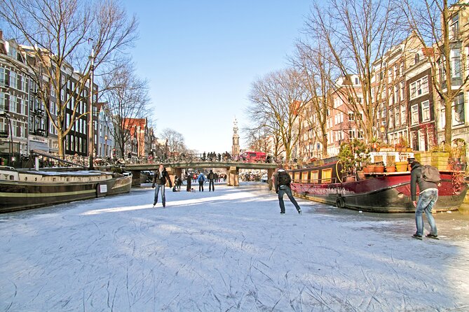 Amsterdam Light Festival Winter Walk with Stroopwafel Workshop - Royal Palace and the Munttoren: Two Landmarks That Place You in Amsterdam’s Center