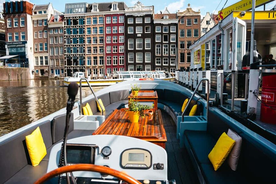 Amsterdam: Open Boat Canal Cruise (with Free Spritz Option) - What the guide and skipper do on the water