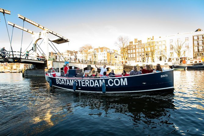 Amsterdam Open Boat Cruise with Live Guide and Two Drinks - What You See Near the Start: Hermitage Museum and the Amstel