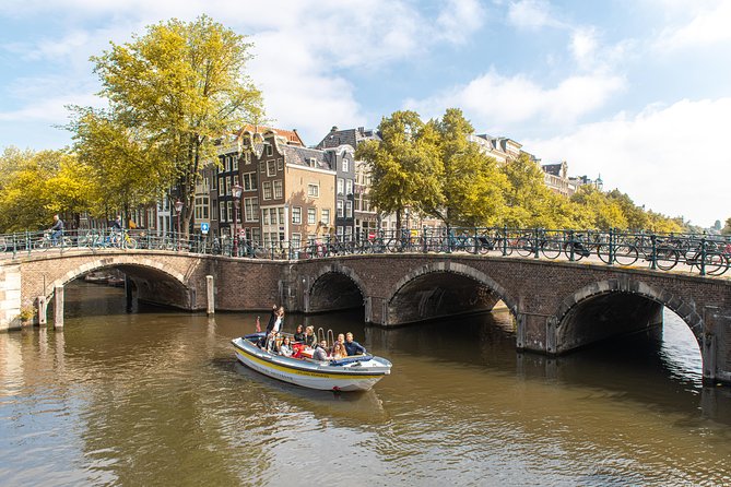 Amsterdam Open Boat Tour with Local Guide - From water level: why this canal cruise feels different than walking