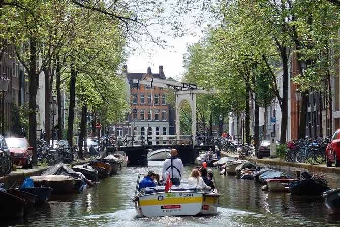 Amsterdam Open Boat Tour with Local Guide - Where solo, couples, and first-timers fit best