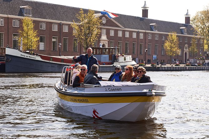 Amsterdam Open Boat Tour with Local Guide - The route: Bridge of Love, historic canals, and a seven-bridges moment