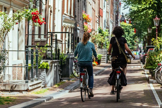 Amsterdam PRIVATE Bike Tour With Locals: Bike & Local Snack Included - The main ride through canals, markets, and the Jordaan feel