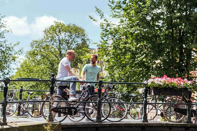 Amsterdam PRIVATE Bike Tour With Locals: Bike & Local Snack Included - Meeting at Prins Hendrikkade 14 and getting your rental bike sorted fast
