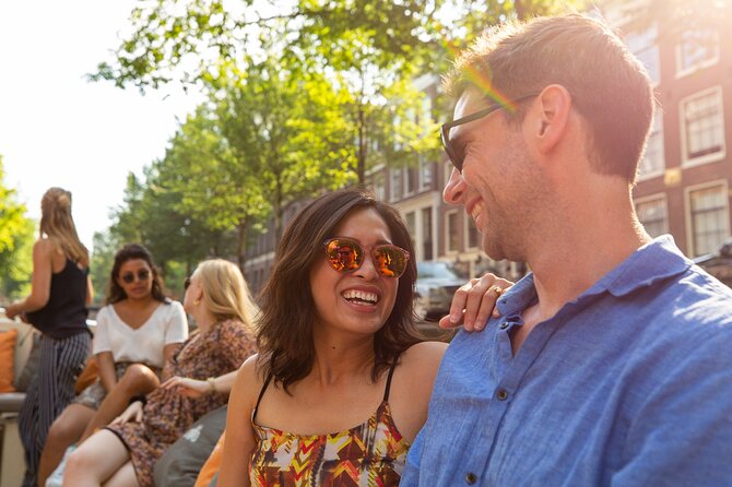 Amsterdam Private Boat Trip with Pizza and Unlimited Drinks - Art museums and a church tower with a wide city view