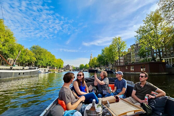 Amsterdam Private Canal Cruise – 90 Minutes through the Old City - Narrow canal views, Munttoren, and passing the edge of De Wallen
