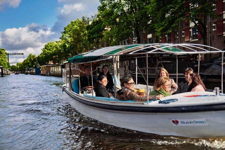 Amsterdam: Private Canal Tour - Seven Bridges and Dancing Houses from the water, with photo-friendly pacing