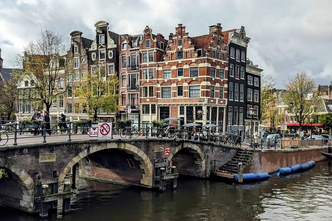 Amsterdam private city walking experience with a local - House on the Three Canals: canal logic and the bicycle bridge idea