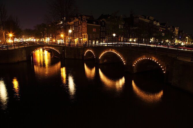 Amsterdam: Private Romantic Evening Canal Cruise + Bubbles/Snacks - Seven Bridges Lit Up at Night