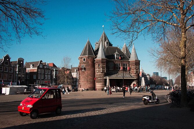 Amsterdam Private Walking Tour with Dinner Experience - Nieuwmarkt and Lastage: the Waag, a highway fight, and streets that now stay calmer